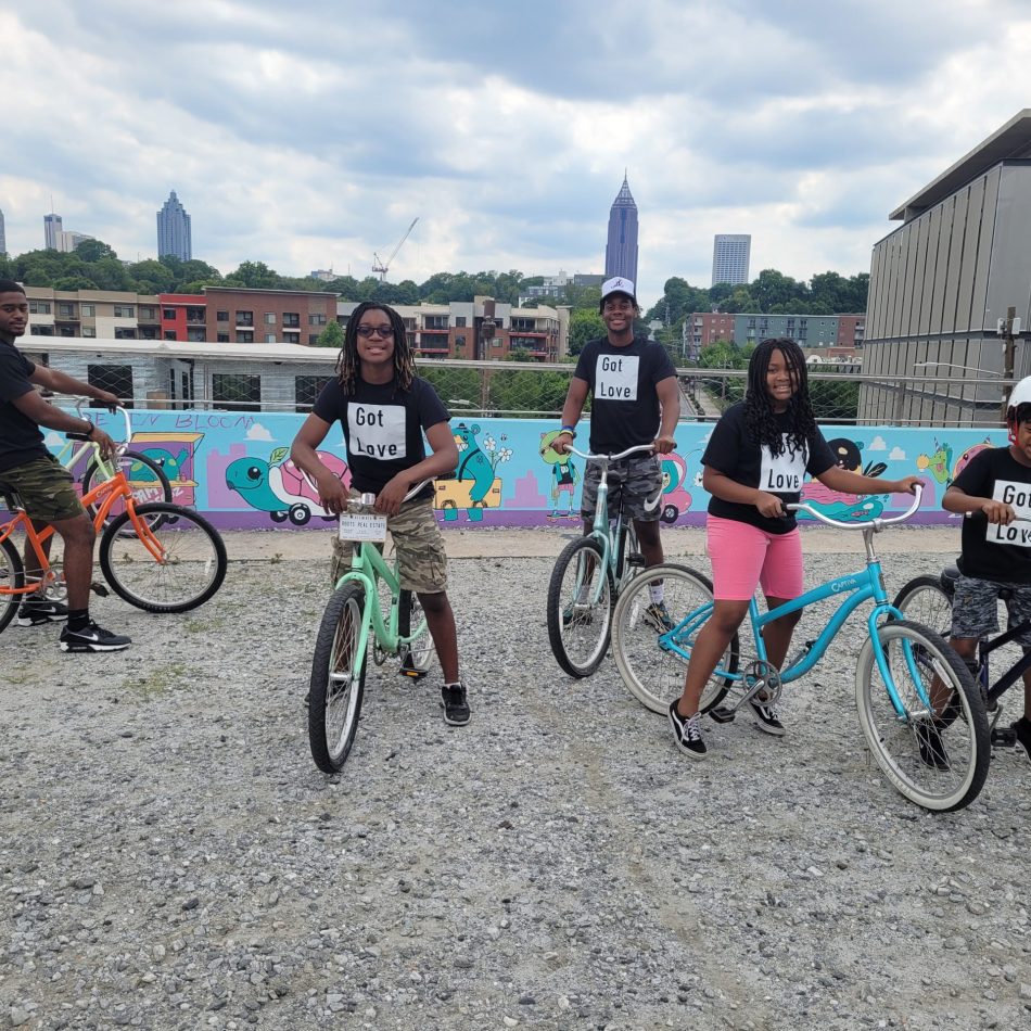 Five African American children on bikes